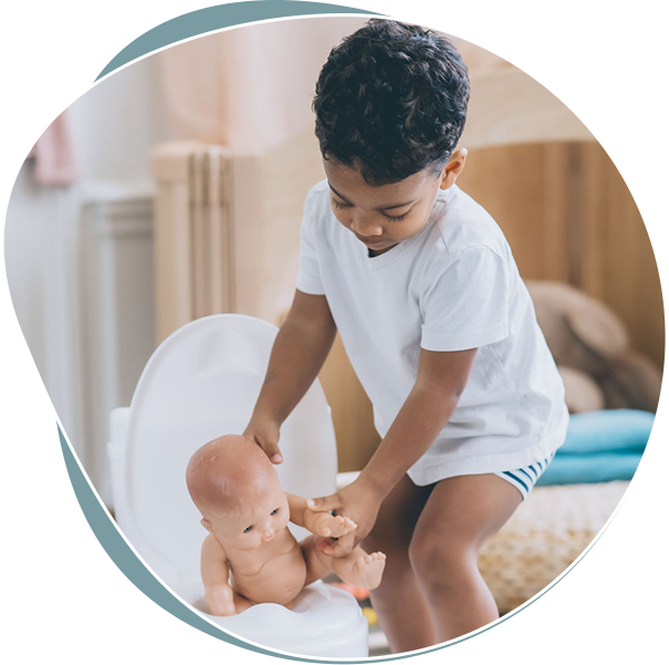 A mother and child are sitting, both laughing and smiling while looking at each other during potty training. The child is holding a towel napkin, while the mother has her arm around the child's back. They are happy to choose the right potty training method. tips for busy parents